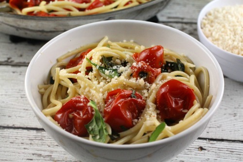 My cherry tomatoes were out of control and this Cherry Tomato Sauce with pasta, basil, spinach and Parmesan was the perfect way to use them in a light meal!