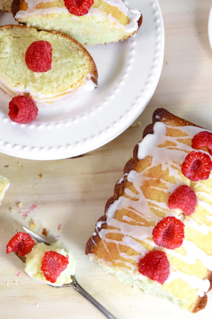 breakfast cake with vanilla glaze and raspberries