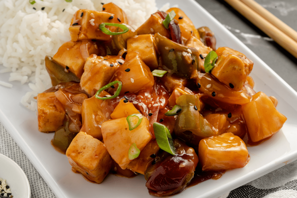 crispy sweet and sour tofu recipe on white plate