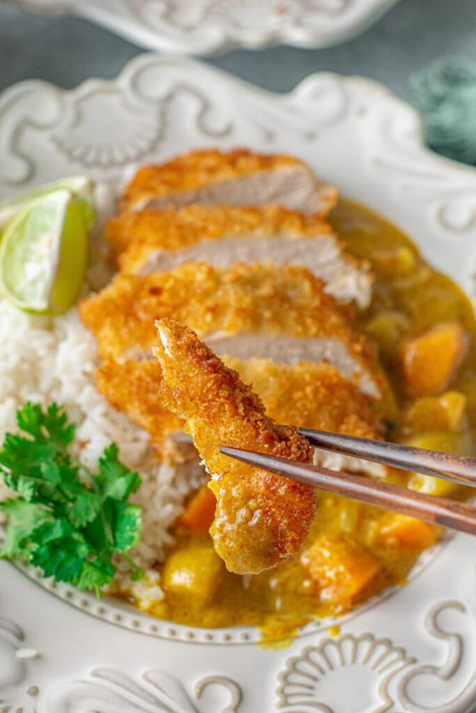 japanese chicken katsu curry recipe bite with chopsticks