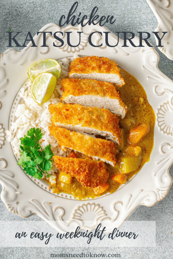 chicken katsu curry on a bed of rice with lemon wedge