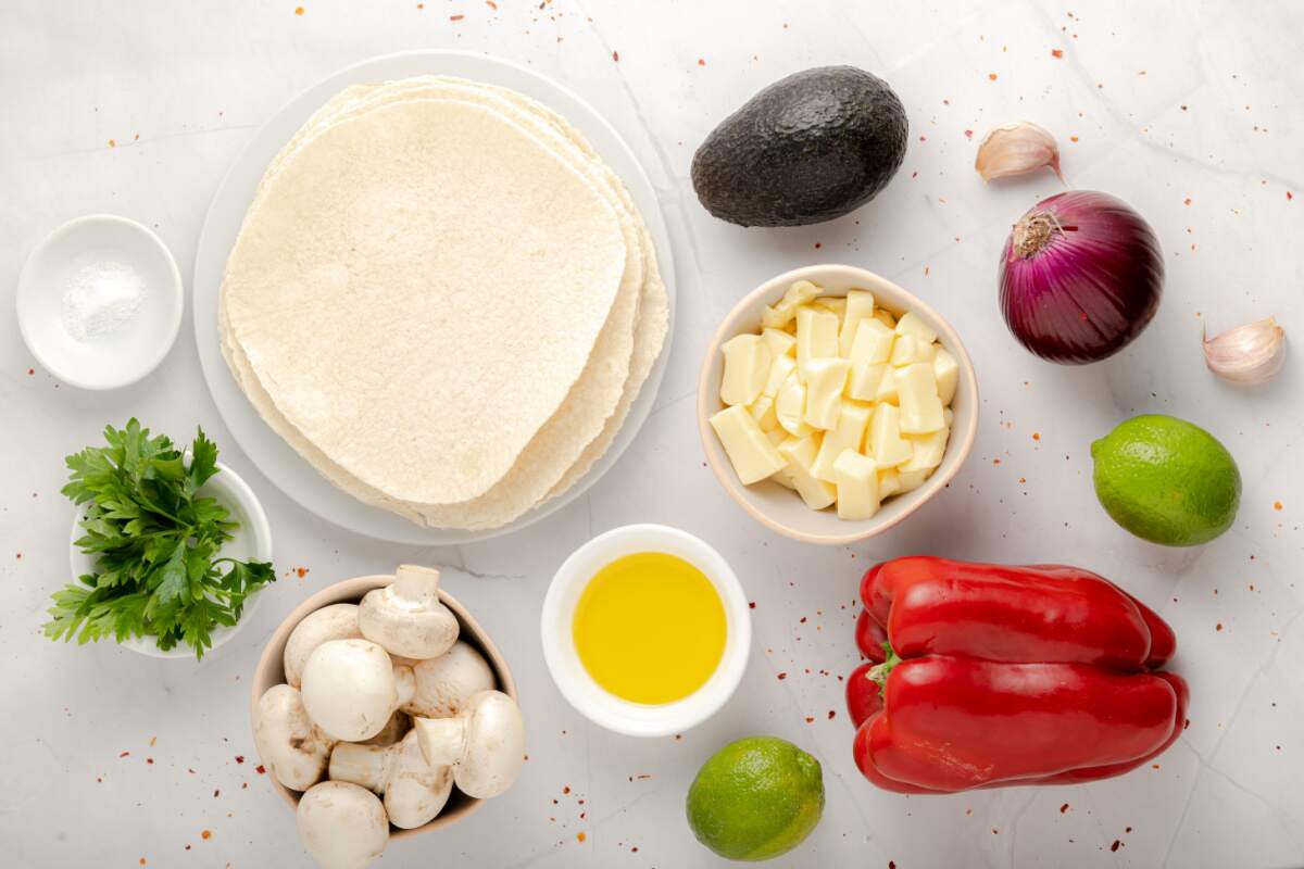 ingredients for mushroom quesadillas on a white background