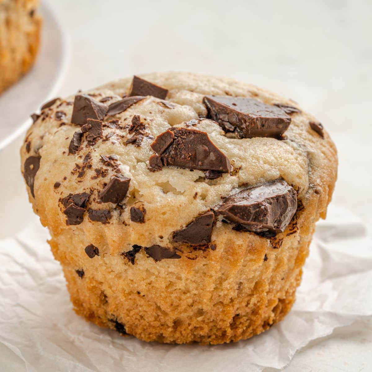 close up picture of a vegan muffin with chocolate chunks