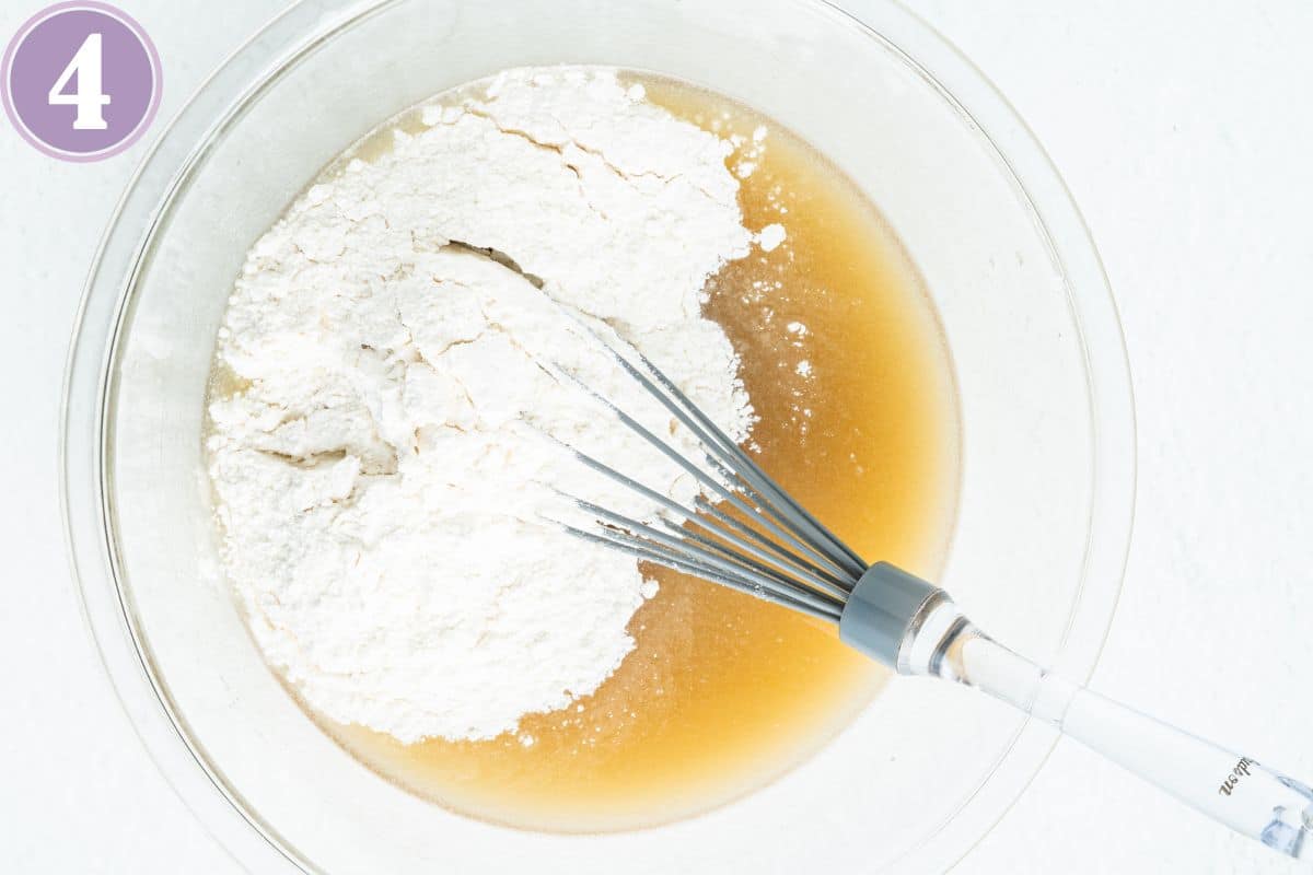 process shot of vegan muffin recipe - adding the dry ingredients to the liquids