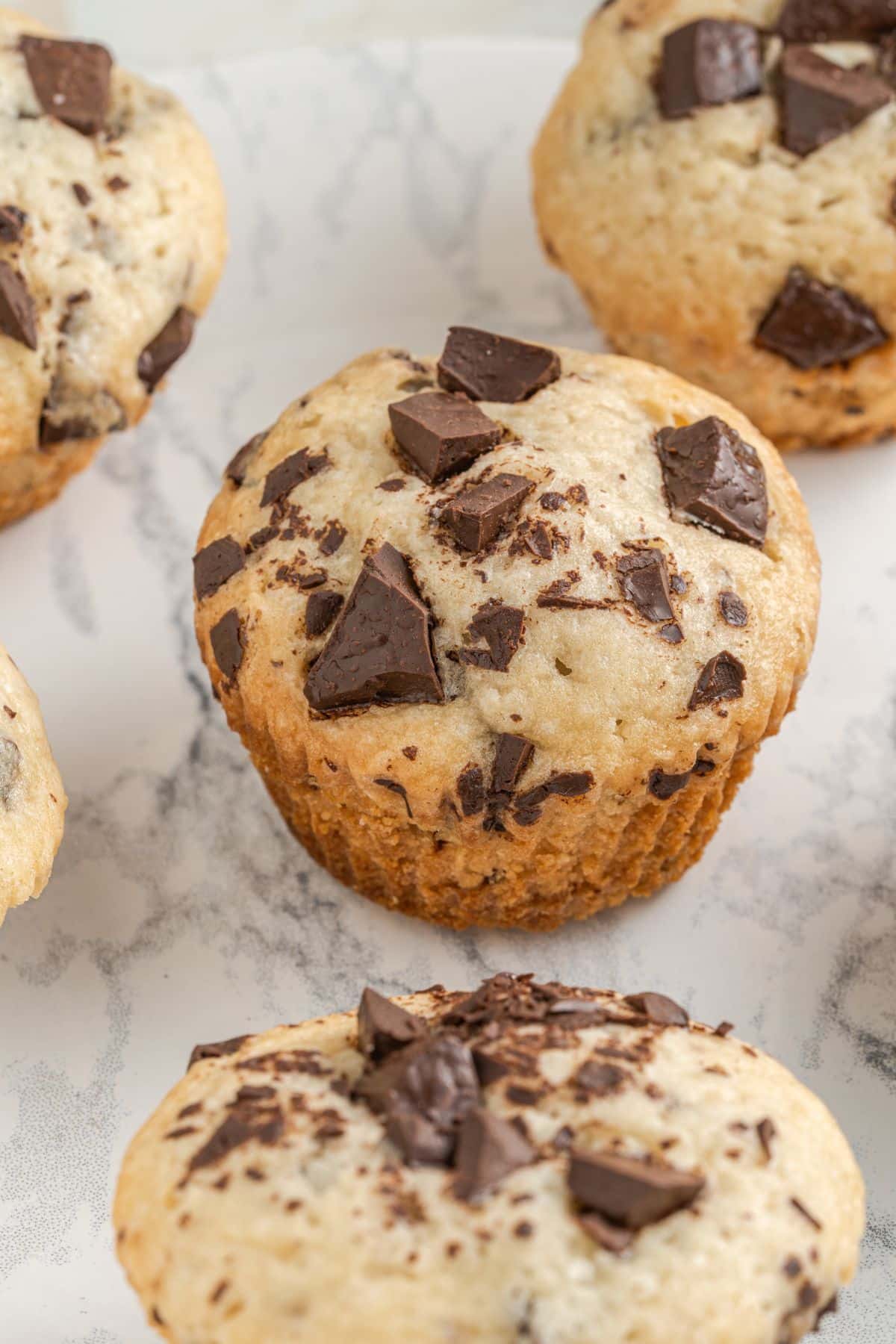 vegan chocolate chip muffins on a white background
